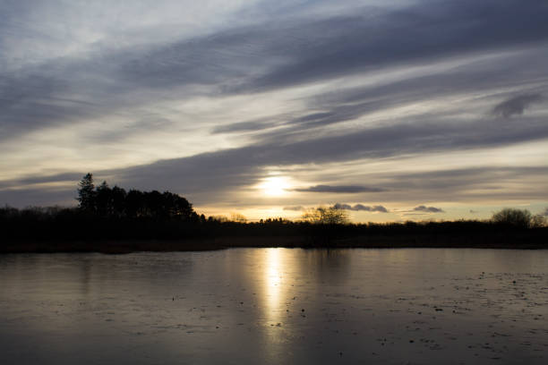 istock Sunset over Frozen Loch 947960128