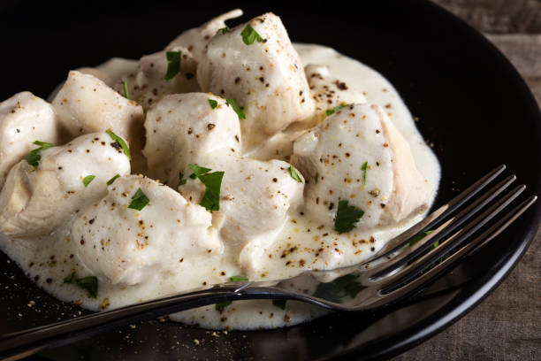 istock Chicken meat with sour cream and herbs 947964590