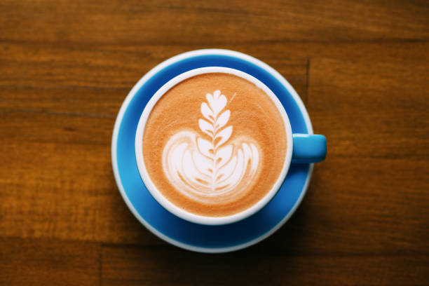 a cup of cappuccino on table. - coffee top view imagens e fotografias de stock