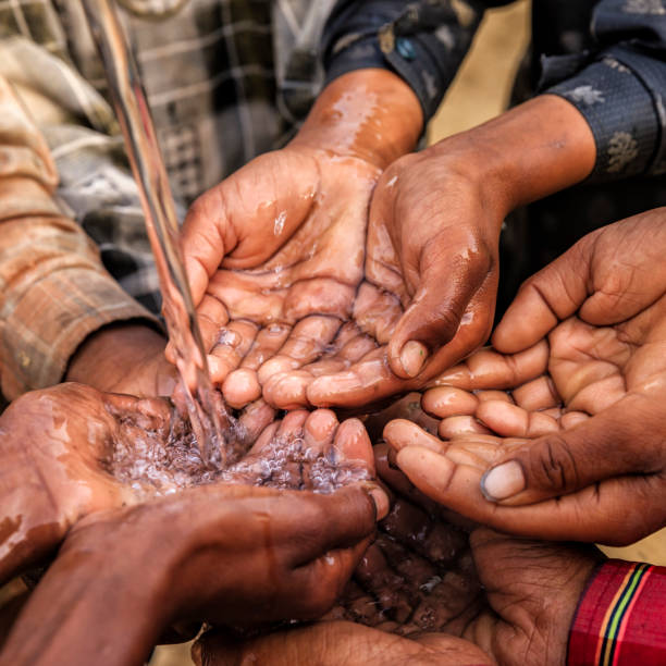 istock Poor Indian children asking for fresh water, India 947984056