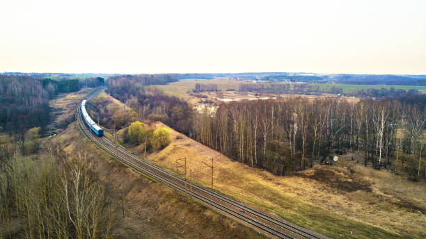 istock Train passing to a distance at the double line railway 947984662