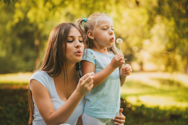 istock Mother And Daughter In The Park 947988574