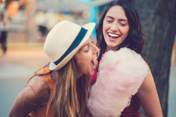 istock Friends eating cotton candy outside 947988886