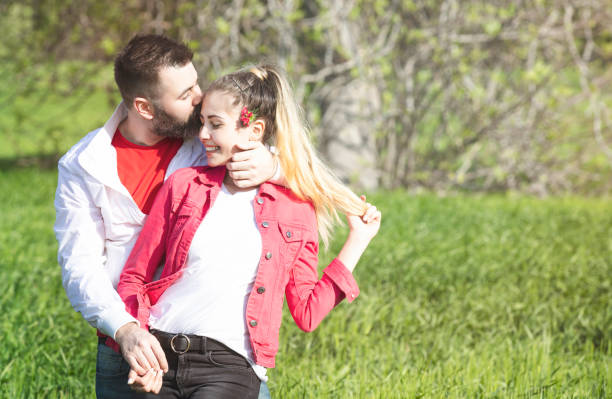 istock young happy couple hug each other 947989400