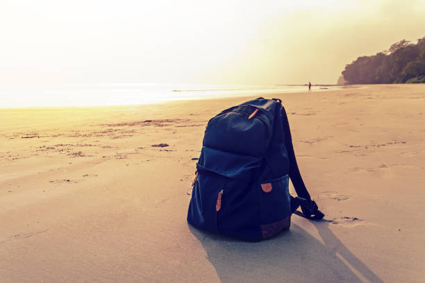 Travel Backpack on Summer Sea Beach. Travel Backpack on Summer Sea Beach. the concept of travel tourism, recreation and Hiking shoulder bag stock pictures, royalty-free photos & images