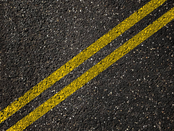istock Asphalt road with double yellow lines 948019328