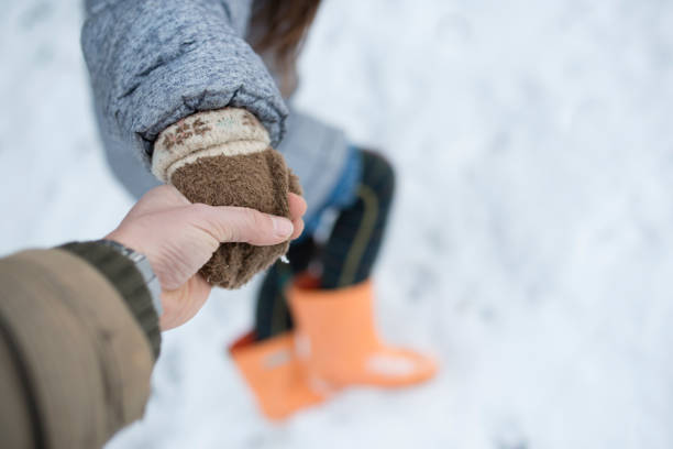istock Little girl playing with snow 948031348