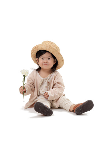 The Asian cute toddler on the white background.
