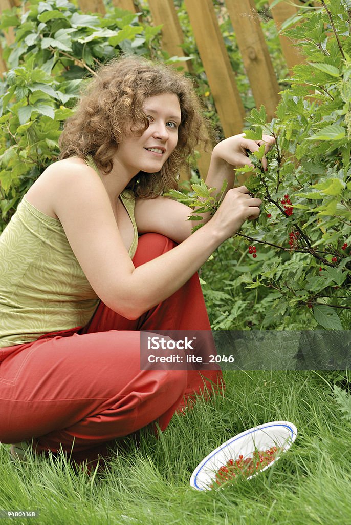 Young woman with crop of red currant  20-24 Years Stock Photo