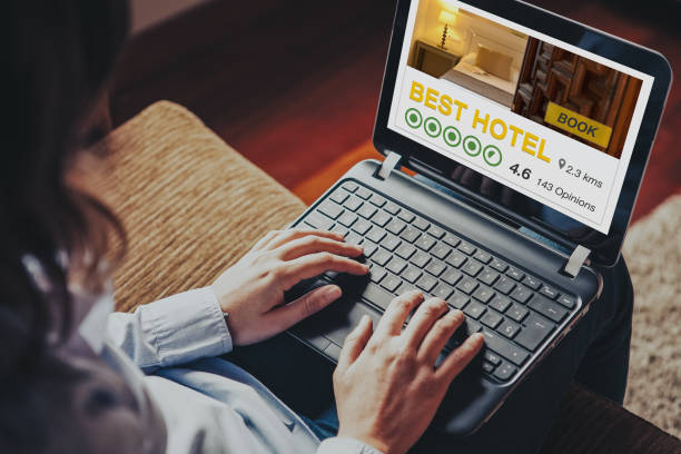 istock Woman booking the best hotel by internet with a laptop computer. 948042650