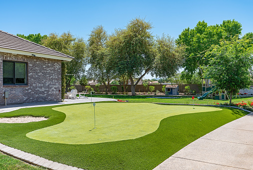 Photo of a modern home putting green.