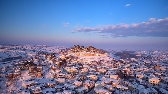 Aerial shot of a golden dawn after a week of snowstorm in the medieval town of Didymoteicho in northern Greece.