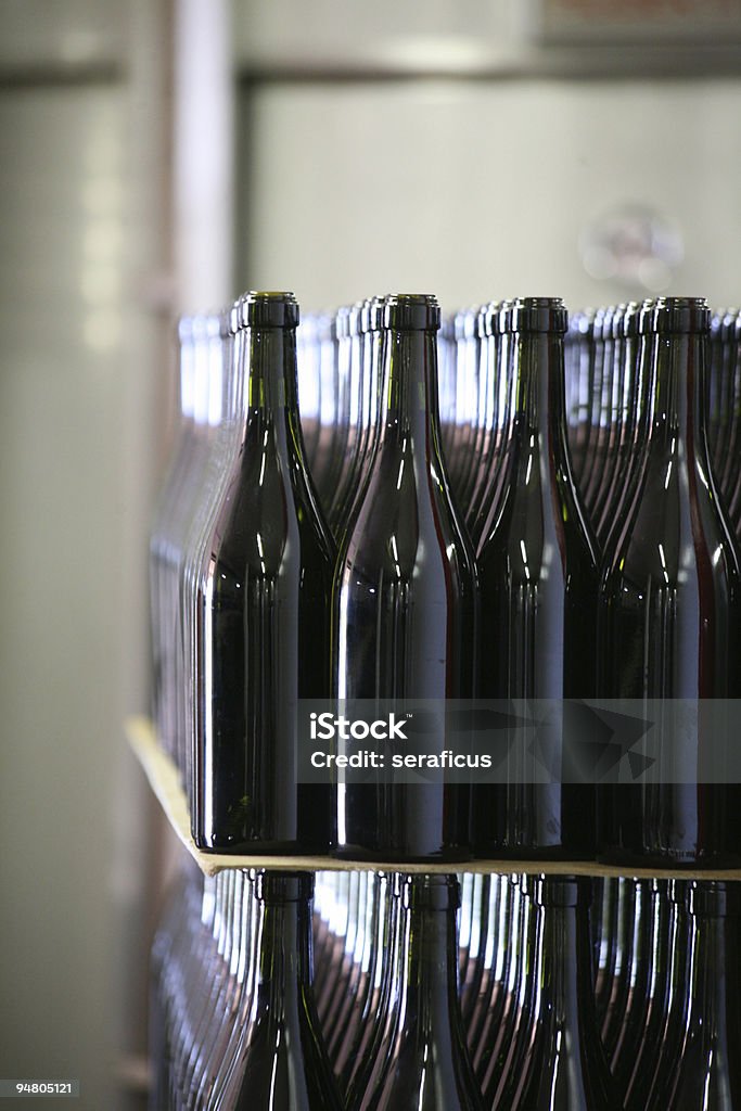 Close-up of rows full of generic wine bottles Wine bottles on a shelf. Other images in: Abruzzo Stock Photo