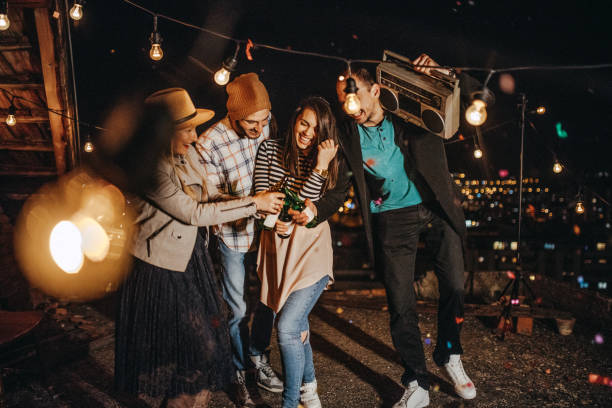 istock Teens celebrating a funny rooftop party 948058004