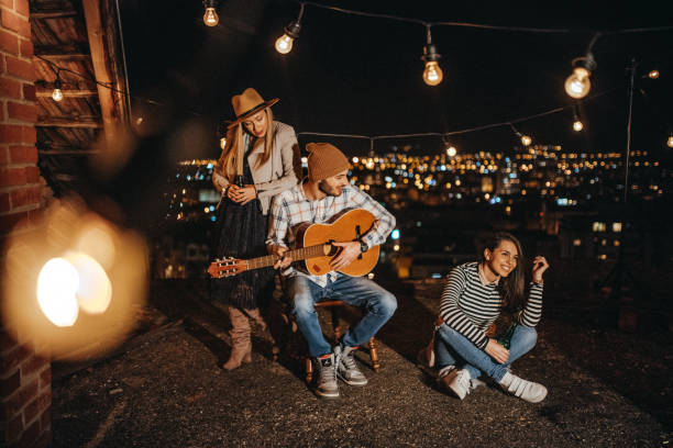 istock Friends drinking and partying on the rooftop 948069138