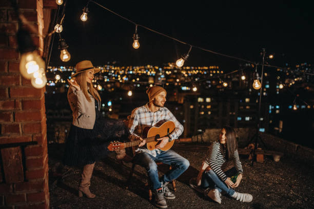 istock Friends drinking and partying on the rooftop 948070620