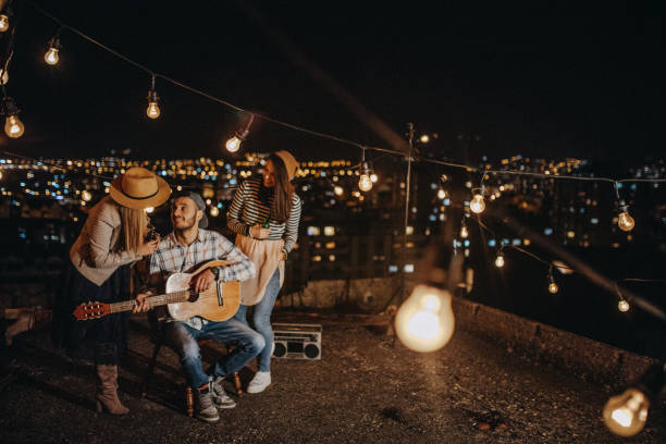 istock Friends drinking and partying on the rooftop 948072950