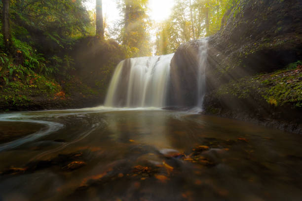 istock Sun rays over Hidden Falls waterfall along Rock Creek in Clackamas OR Fall Season 948075172