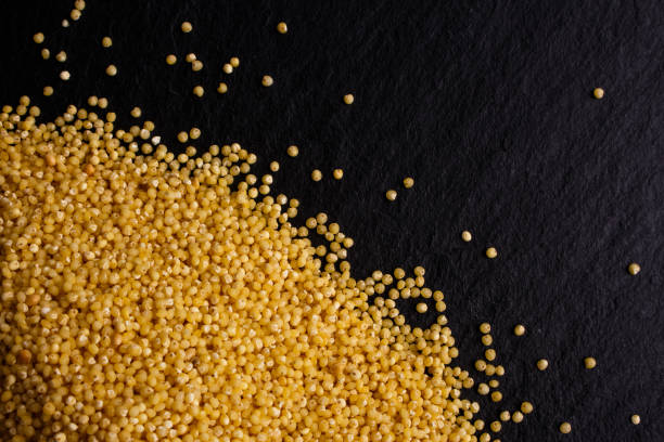 istock a bunch of millet on a dark rocky background 948081800