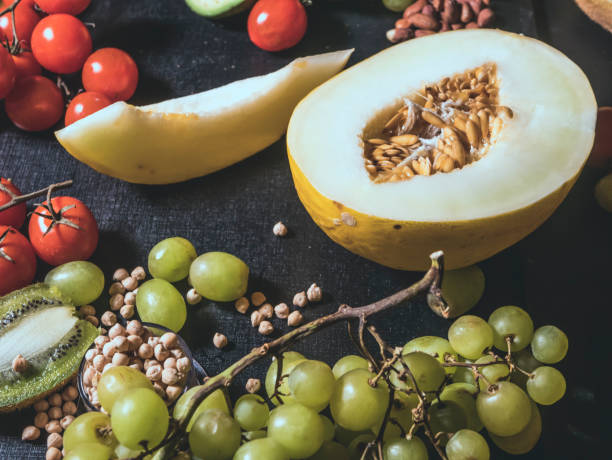 istock close up sliced tropical fresh raw fruits on dark surface 948081988