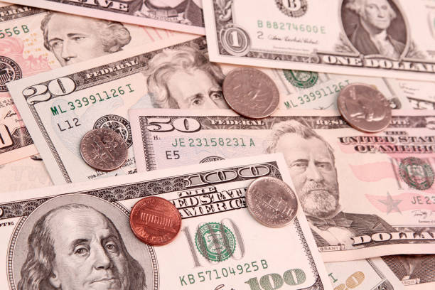 istock American coins and banknotes 948082558