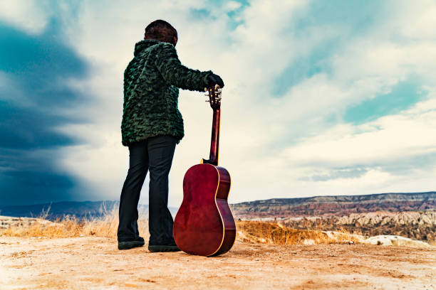 woman,guitar,music,sky,blue,hat