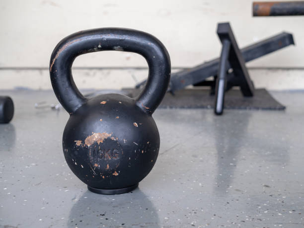 istock Black, 10 kg kettlebell sitting on hard gym floor 948089238