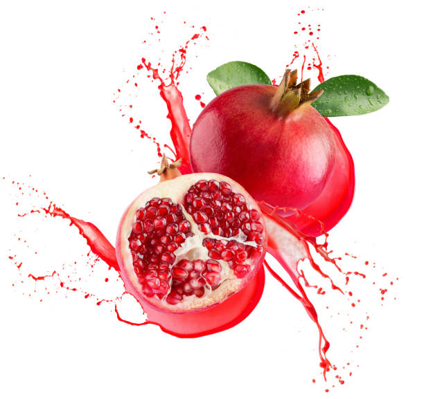 istock pomegranates in juice splash isolated on a white background 948094612