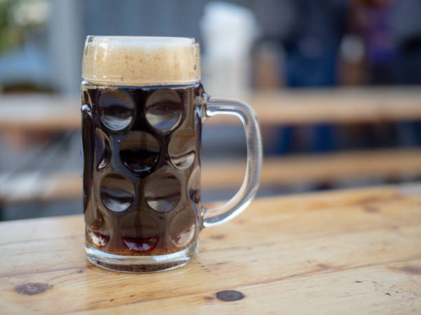 istock German glass beer mug filled with a dark ale 948095610