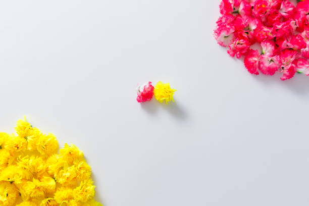 istock Flowers composition. Frame made of pink and yellow flowers. 948096284