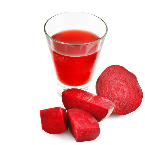 istock Red beet and fresh juice in a glass isolated on white background. 948105144