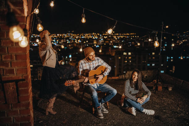 istock Teens celebrating a funny rooftop party 948105240