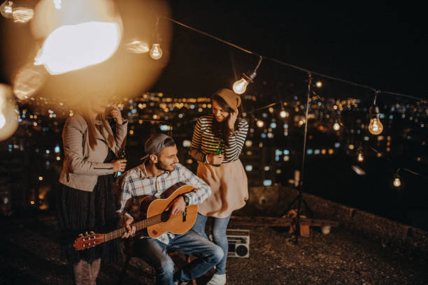 istock Teens celebrating a funny rooftop party 948105526