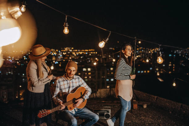 istock Teens celebrating a funny rooftop party 948105892