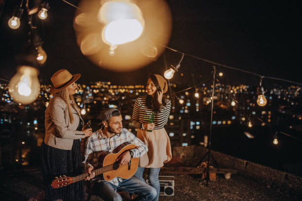 istock Teens celebrating a funny rooftop party 948106160