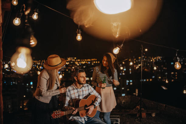 istock Teens celebrating a funny rooftop party 948106438