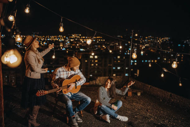 istock Teens celebrating a funny rooftop party 948106734