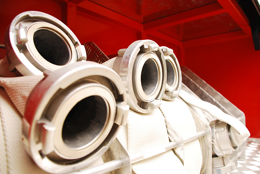 Fire-hoses on a track,nice red and off white,naturel light