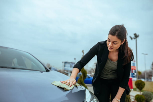 istock Drying the hood of a car 948121368