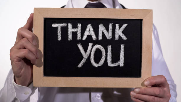 istock Thank you text on blackboard in therapist hands, clinic services presentation 948129270