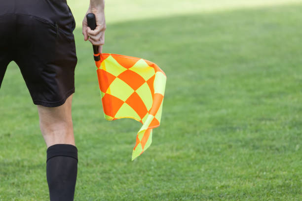 Assistant referees in action during a soccer match Assistant referees in action during a soccer match offside stock pictures, royalty-free photos & images