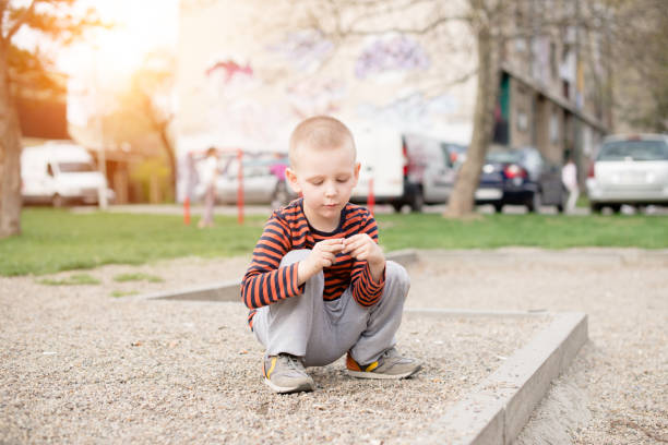 Little boy is playing on a urban playground
