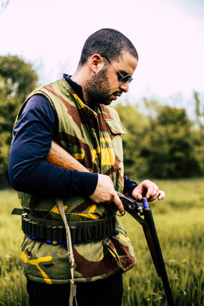 istock Hunting equipment and young hunter 948143480