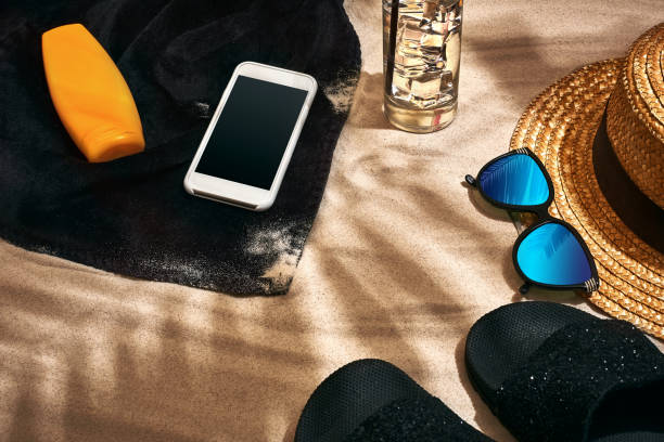 istock Summer background with straw hat, sunglasses, sunscreen bottle and flip flops 948152726