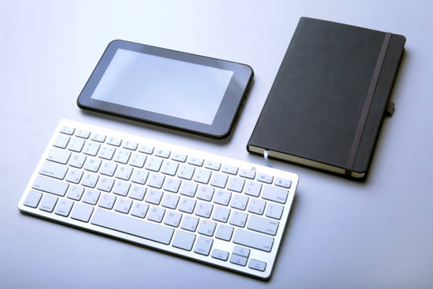 istock Corporate business desktop with laptop, digital tablet, accessories and work equipment. selective focus. 948156868