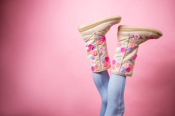 Sexy woman legs in blue woolen stockings and boots Sexy woman legs in blue woolen stockings and boots on pink background. ananas stock pictures, royalty-free photos & images