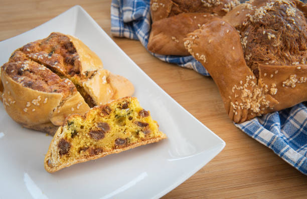 Traditional Cypriot easter cheese cakes cooked on a clay oven. The easter pastries are called flaounes and are made with various cheese.