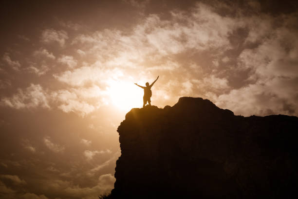 istock Men hiker enjoy the view on mountain peak cliff 948164340