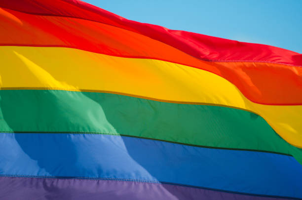 istock Gay Pride Rainbow Flag Flying in the Wind Close-Up 948175662