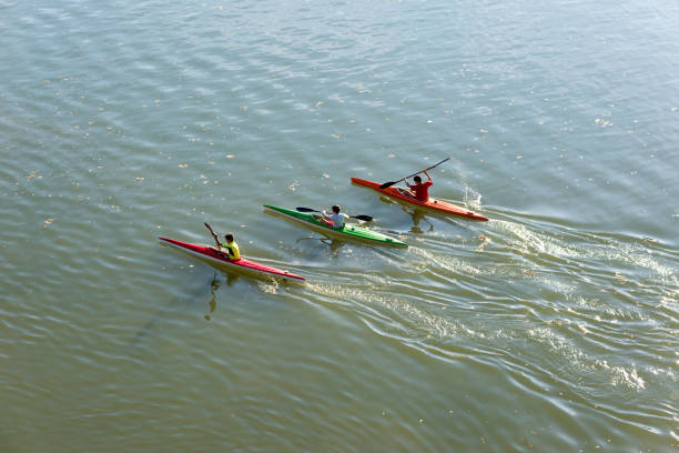 Senta, Serbia - October 17, 2017: Boys kayaking on river Tisa, Serbia, on sunny autumn day.